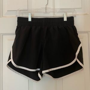 Black athletic shorts with white trim